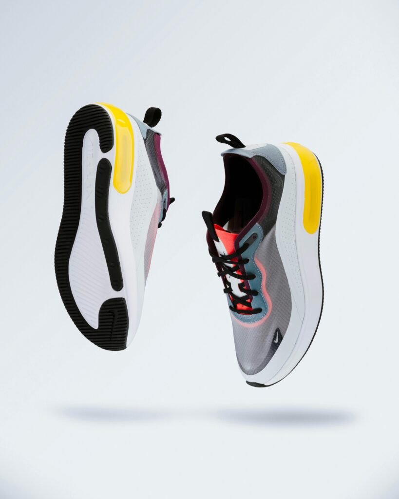Best Fitness Shoes for the Holidays: From Running to Lifting Floating modern sneakers showcasing trendy design and vibrant colors.