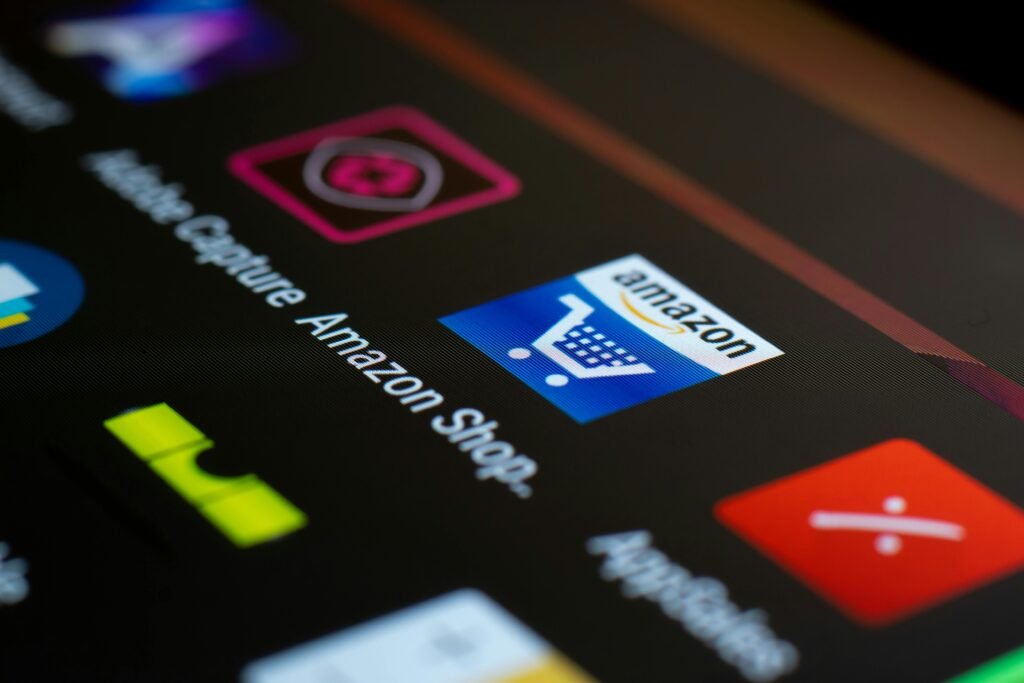 pexels photo 4560039 4560039 Close-up of the Amazon shopping app icon on a smartphone screen. Ideal for online shopping and technology themes.